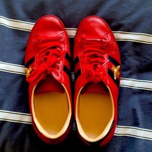 Used red Gucci sneakers.